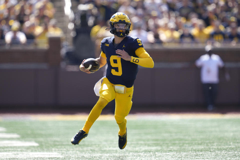 Michigan quarterback J.J. McCarthy (9) runs the ball against Rutgers in the first half of an NCAA college football game in Ann Arbor, Mich., Saturday, Sept. 23, 2023. (AP Photo/Paul Sancya)