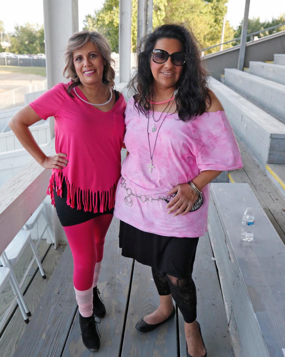 Teresa Martinez, left, and Emma Schwartz won best dressed group during Thursday's grandstand event at the Lenawee County Fair, “Bodacious Moves and Big Hair at the Fair: Lenawee’s Premier ’80s Dance Party.” Prizes were awarded to the best dressed group, the best dressed female and the best dressed male.