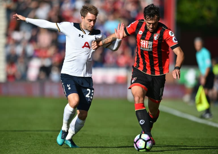Tottenham Hotspur's midfielder Christian Eriksen (L) vies with Bournemouth's midfielder Charlie Daniels during the English Premier League football match between Bournemouth and Tottenham Hotspur at the Vitality Stadium on October 22, 2016