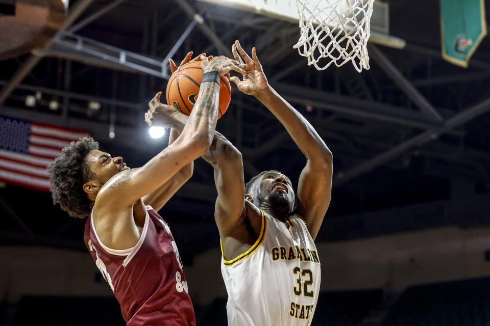 Texas Southern forward John Walker III (24) blocks the shot of Grambling State forward Malik Lamin (32) during the first half of an NCAA college basketball game in the championship of the Southwestern Athletic Conference Tournament, Saturday, March 11, 2023, in Birmingham, Ala. (AP Photo/Butch Dill)