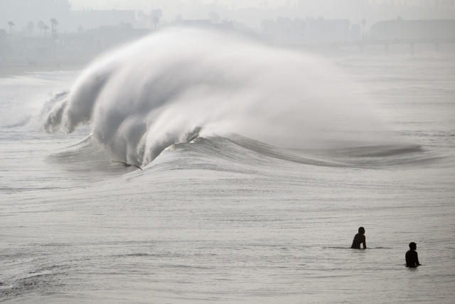 Huge surf pounds West Coast and Hawaii, flooding some low-lying areas