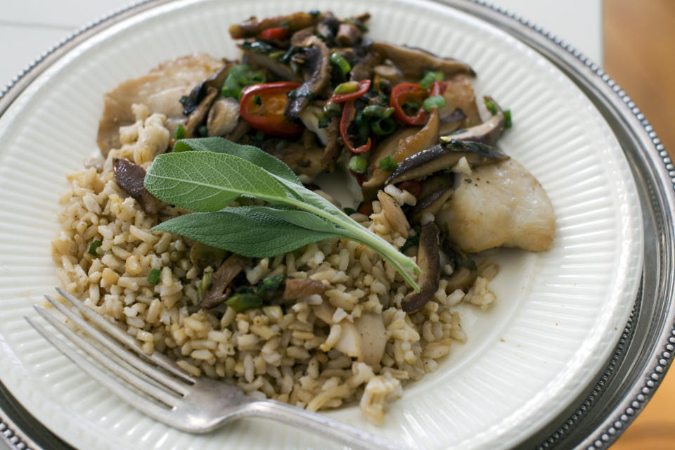 In this image taken on Dec. 3, 2012, Chinese-styled steamed tilapia is shown served on a plate in Concord, N.H. (AP Photo/Matthew Mead)