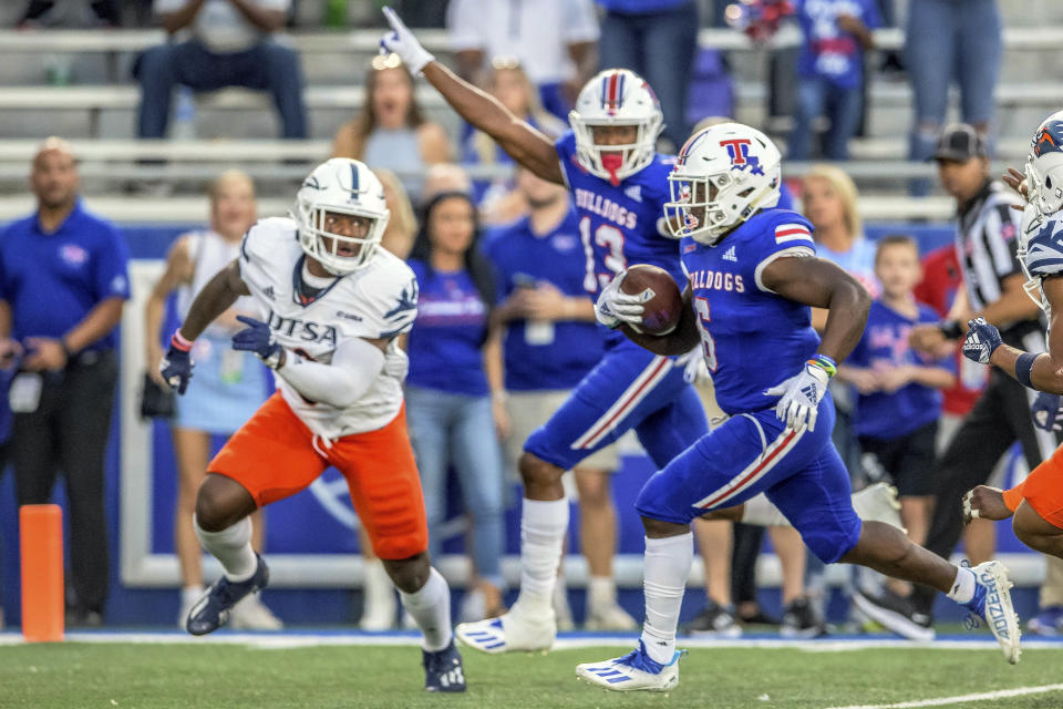 Louisiana Tech wide receiver Smoke Harris (6) scores a touchdown against UTSA in the first half of an NCAA college football game in Ruston, La., Saturday, Oct. 23, 2021. (AP Photo/Matthew Hinton)