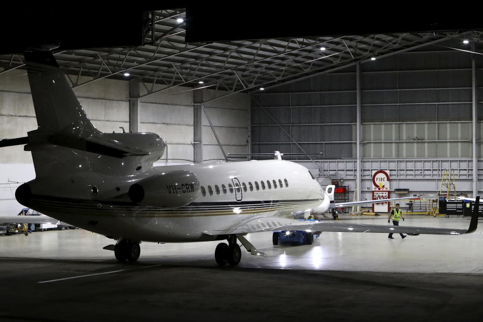 A jet transporting Shane Warne's body, pictured here arriving at Melbourne airport from Bangkok.