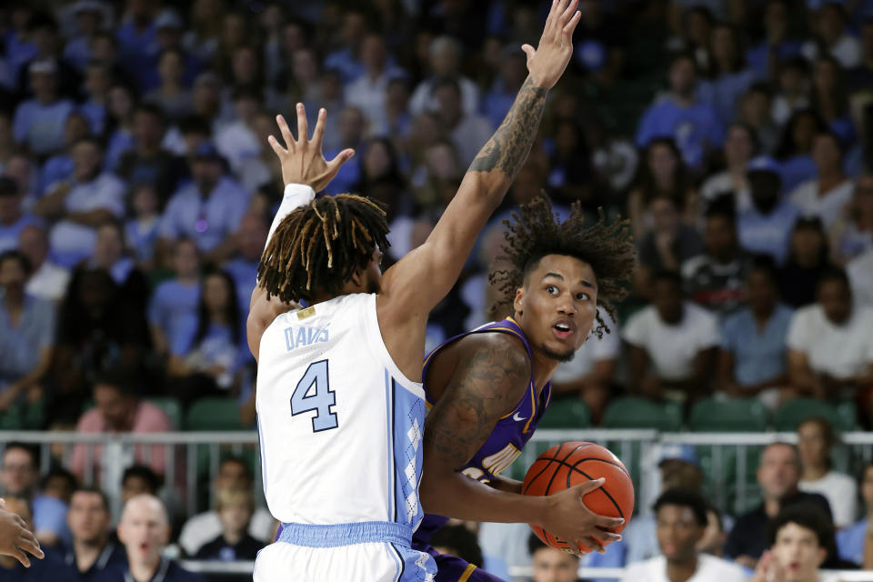 Northern Iowa's Tytan Anderson guarded by North Carolina Tar Heels's RJ Davis during the first quarter of an NCAA college basketball game in the Battle 4 Atlantis at Paradise Island, Bahamas, Wednesday, Nov. 22, 2023. (Tim Aylen/Bahamas Visual Services via AP)