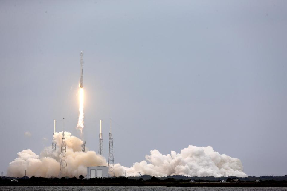 A SpaceX rocket Dargon cargo ship lifts off from launch complex 40 at the Cape Canaveral Air Force Station in Cape Canaveral, Fla., Friday, April 18, 2014. The rocket will deliver research equipment, food and other supplies to the International Space Station. (AP Photo/John Raoux)