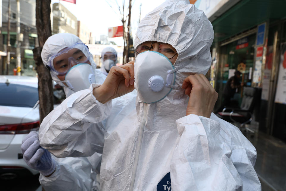 SEOUL, SOUTH KOREA - FEBRUARY 27: Disinfection professionals wearing protective gear prepare to disinfect against the coronavirus (COVID-19) on February 27, 2020 in Seoul, South Korea. Government has raised the coronavirus alert to the "highest level" as confirmed case numbers keep rising. Government reported 334 new cases of the coronavirus (COVID-19) bringing the total number of infections in the nation to 1,595 with the potentially fatal illness spreading fast across the country. (Photo by Chung Sung-Jun/Getty Images)