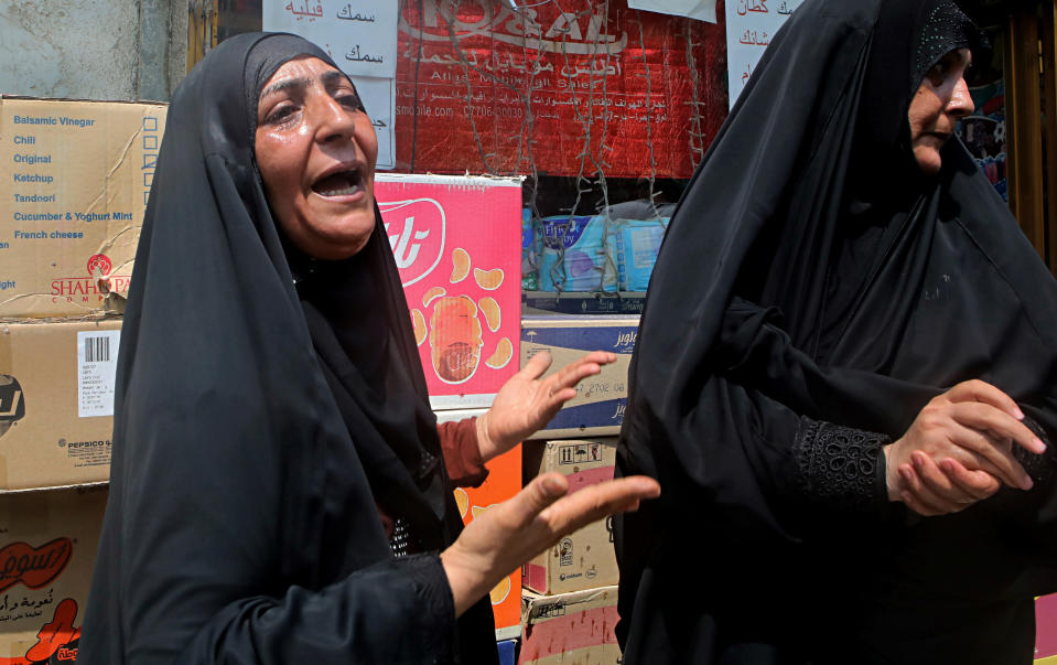 Family members of Mekki Yasser, a protester whose family and activists said he was killed when he participated in a protest last night, grieve during his funeral on Tuesday, Sept. 4, 2018, in Basra, about 340 miles (550 kilometers) southeast of Baghdad, Iraq. (AP Photo/Nabil al-Jurani)