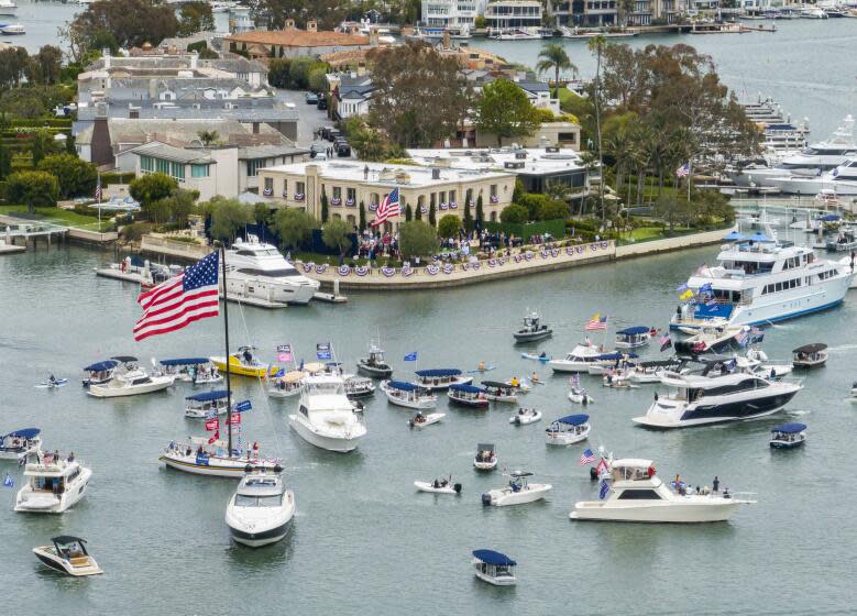 NEWPORT BEACH, CA - JUNE 08: Supporters turned out, even on boats, for Donald Trump's fundraising visit to Newport Beach hosted by Palmer Luckey and Kimberly and John Word on Saturday, June 8, 2024. (Myung J. Chun / Los Angeles Times)