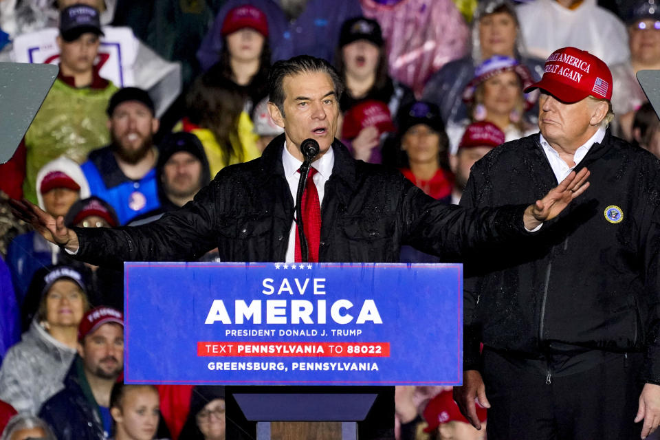 Dr. Mehmet Oz, with former President Donald Trump at his side, speaks at a rally.