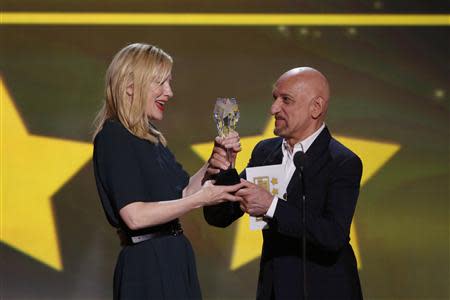 Ben Kingsley presents actress Cate Blanchett the award for best actress for her role in "Blue Jasmine" at the 19th annual Critics' Choice Movie Awards in Santa Monica, California January 16, 2014. REUTERS/Mario Anzuoni