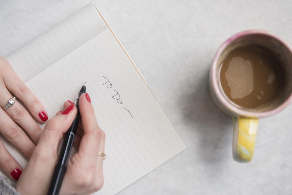 Woman writing to-do list for how to have more energy