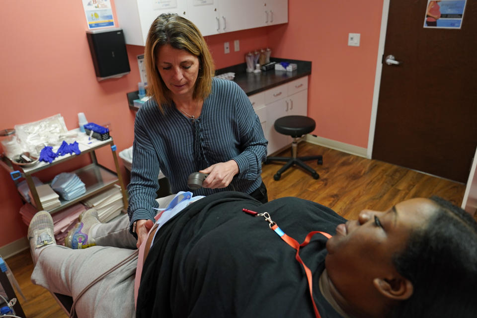 Dr. Michele Urban, M.D., cares for Tamara Spates, of Salisbury, Md., during a prenatal visit at a Chesapeake Health Care office in Salisbury, Md., Thursday, March 2, 2023. (AP Photo/Susan Walsh)