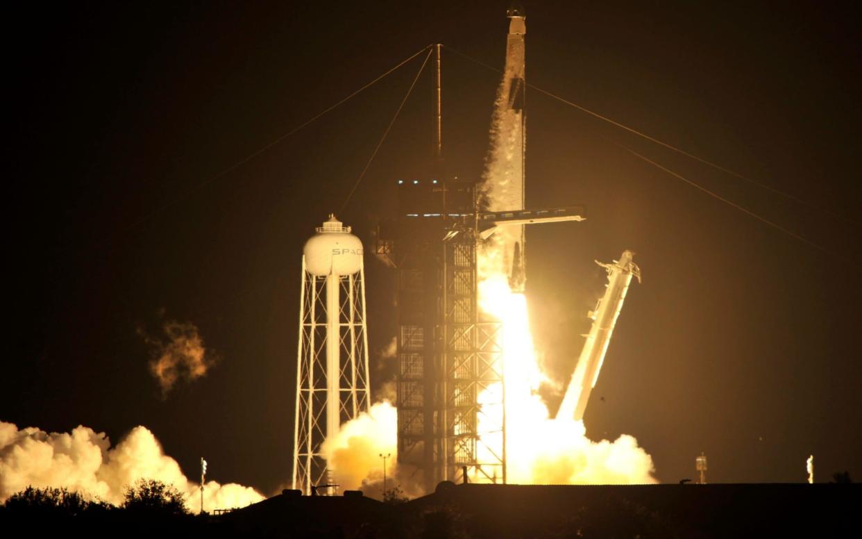 A SpaceX Falcon 9 rocket, topped with the Crew Dragon capsule carrying four astronauts on the first operational NASA commercial crew mission, launches at the Kennedy Space Center - Reuters