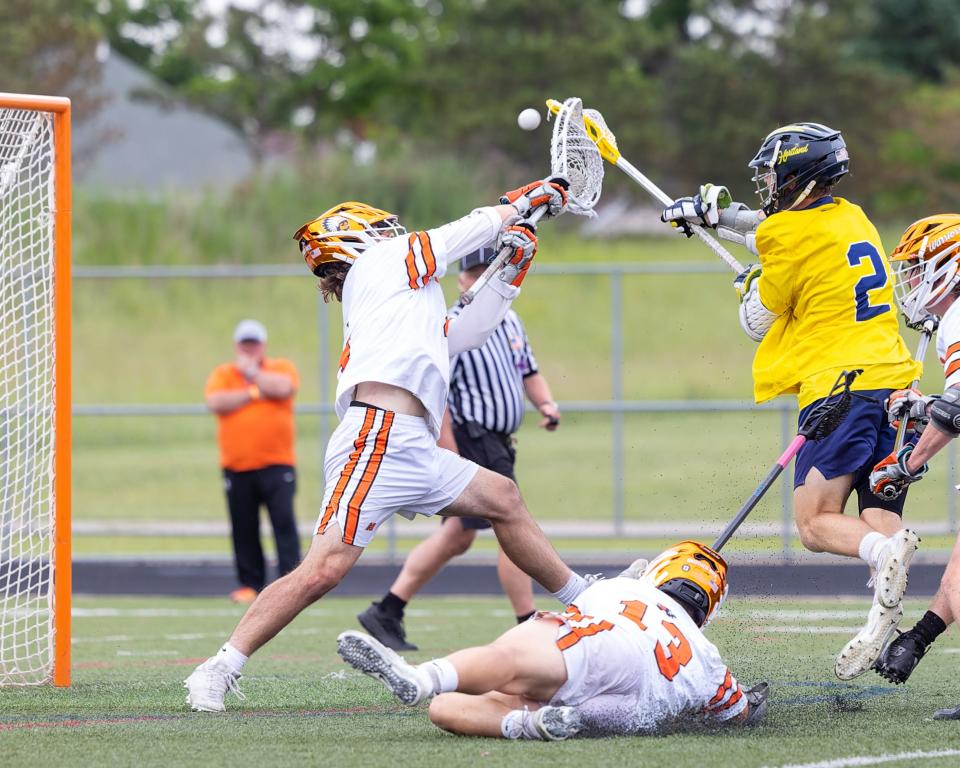 Bo Lockwood (2) fires the game-winning goal past Birmingham Brother Rice goalie Cam Sims in overtime, giving Hartland an 11-10 victory in the state Division 1 championship game on Saturday, June 11, 2022.