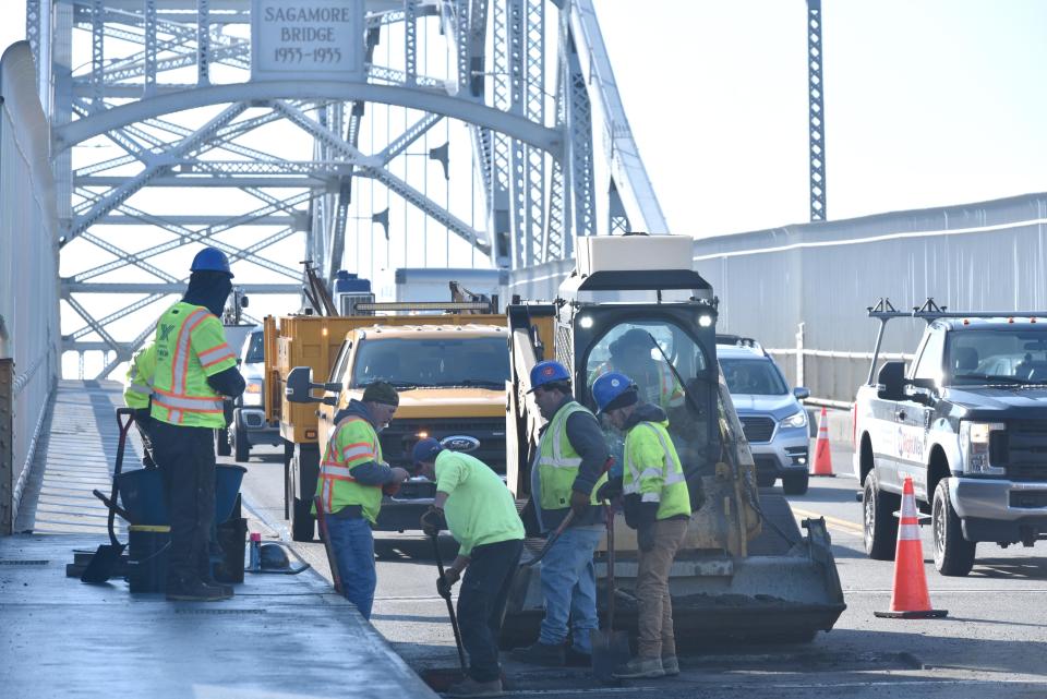 Work crews do emergency repairs to the road surface on the northbound lane of the Sagamore Bridge, which was reduced to two lanes all day Wednesday, snarling traffic. More lane restrictions are coming in March for additional work on the structure.