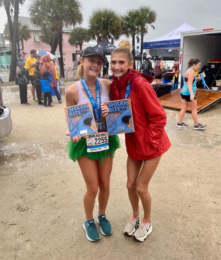 New Smyrna Beach runners Stella Marsch (left) and Olivia Gardner finished 10th and 1st, respectively, in their age groups at the Shark Bite Marathon.