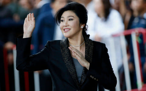 Former Thai prime minister Yingluck Shinawatra waves to supporters as she arrives to deliver closing statements in her trial at the Supreme Court's Criminal Division for Persons Holding Political Positions in Bangkok, Thailand, 01 August 2017 - Credit: EPA