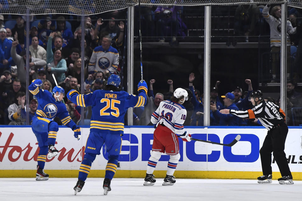 Buffalo Sabres right wing JJ Peterka, left, celebrates after scoring against the New York Rangers during the first period of an NHL hockey game in Buffalo, N.Y., Friday, March 31, 2023. (AP Photo/Adrian Kraus)