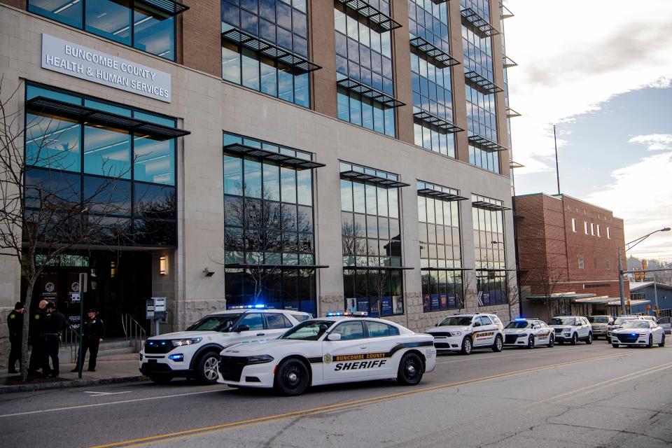 An increased law enforcement presence seen downtown near 40 Coxe Ave. following reports of an active shooter Dec. 20, 2023. The scene was cleared without injury or evidence of a shooter.