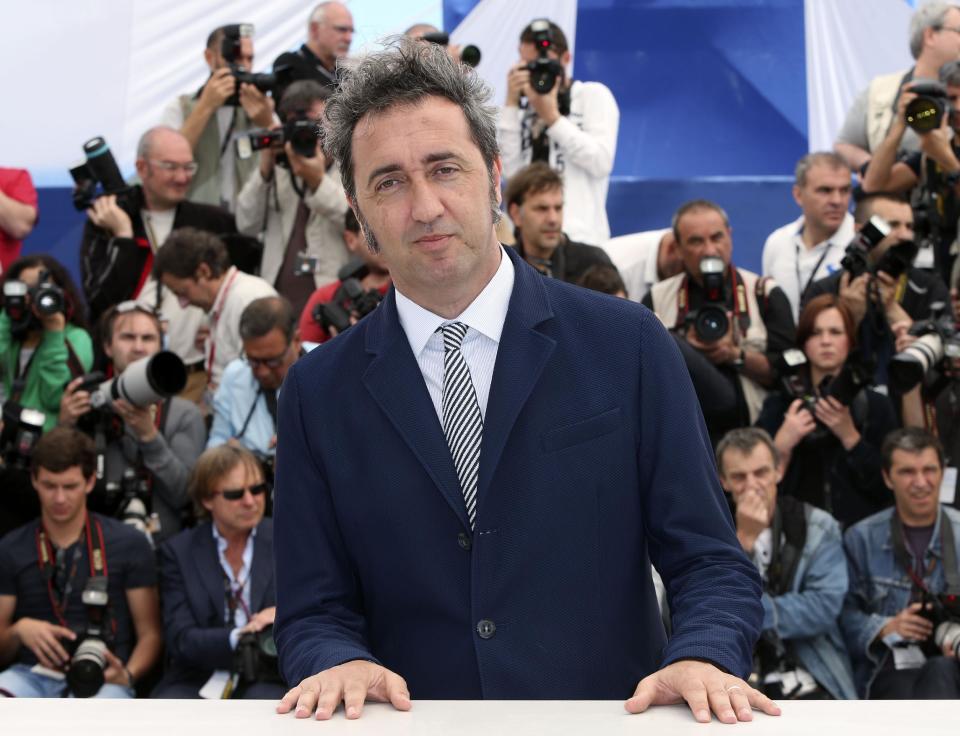 FILE - In this May 21, 2013 file photo, Director Paolo Sorrentino poses for photographs during a photo call for the film "The Great Beauty" at the 66th international film festival, in Cannes, southern France. Four of the five directors of Golden Globe-nominated foreign-language films, Sorrentino, "A Great Beauty," Abdellatif Kechiche, "Blue Is the Warmest Color," Thomas Vinterberg, "The Hunt," and Asghar Farhadi, "The Past," gather in Hollywood for a panel symposium on their films nominated for Best Foreign Language Film at The Egyptian Theatre on Saturday, Jan. 11, 2014. Hayao Miyazaki, whose film, "The Wind Rises" is also nominated in the same category, is unable to attend. (Photo by Joel Ryan/Invision/AP, File)