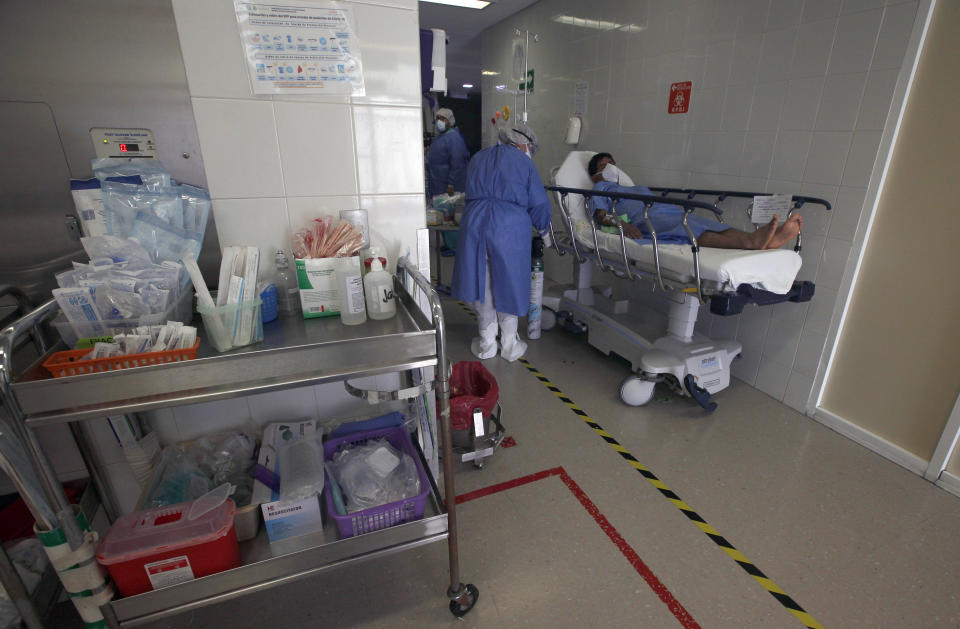 A patient that has just tested positive for COVID-19 lies on a bed in the emergency room of the Mexico City Ajusco Medio General Hospital, Wednesday, Dec. 2. 2020. Mexico continues to report an increase in the number of coronavirus cases, with Mexico City continuing to report the biggest portion of the surge in cases. (AP Photo/Marco Ugarte)