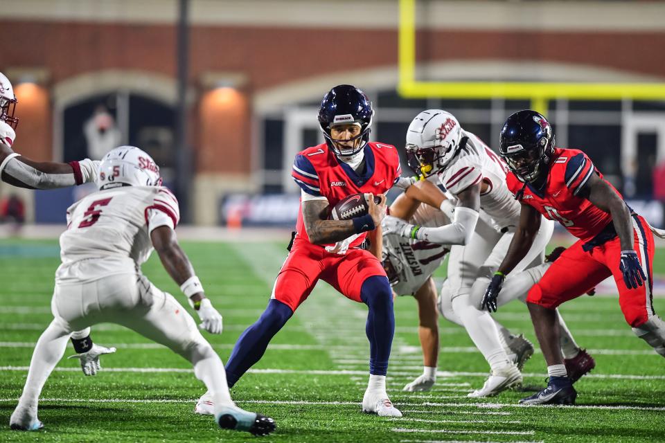 Conference USA: Liberty Flames quarterback Kaidon Salter runs the ball against New Mexico State.