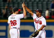 ATLANTA, GA - APRIL 17: Dan Uggla #26 and Michael Bourn #24 of the Atlanta Braves celebrate their 9-3 win over the New York Mets at Turner Field on April 17, 2012 in Atlanta, Georgia. (Photo by Kevin C. Cox/Getty Images)