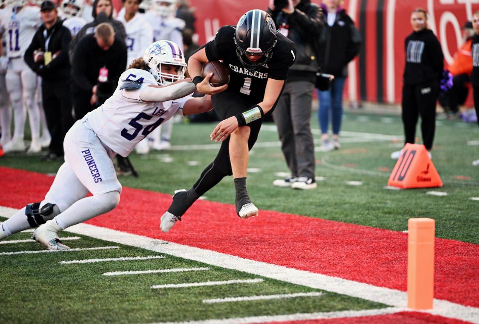 Corner Canyon’s Isaac Wilson is forced out of bounds by Lehi’s Paul Latu just before scoring as they play in high school football semifinal action at Rice-Eccles Stadium in Salt Lake City on Friday, Nov. 10, 2023. Corner Canyon won 63-24. | Scott G Winterton, Deseret News