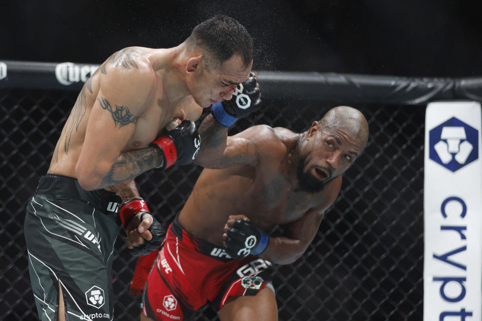 Jul 29, 2023; Salt Lake City, Utah, USA; Tony Ferguson (red gloves) fights Bobby Green (blue gloves) during UFC 291 at Delta Center. Mandatory Credit: Jeff Swinger-USA TODAY Sports