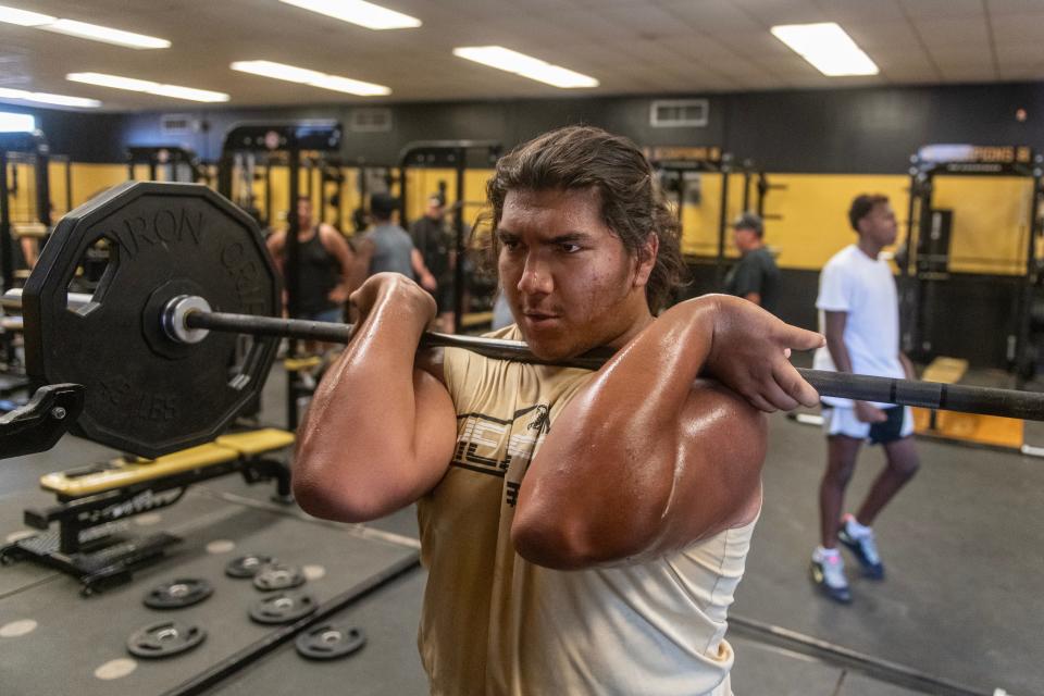 Hesperia's Anthony Ruiz lifts weights before a recent summer football practice at the school. Hesperia begins the season at home against Barstow on Aug. 18.