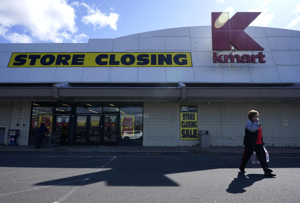 A woman leaves a Kmart in Avenel, N.J., Monday, April 4, 2022. When the store closes its doors on April 16, it will leave only three remaining U.S. locations for the former retail powerhouse. (AP Photo/Seth Wenig)