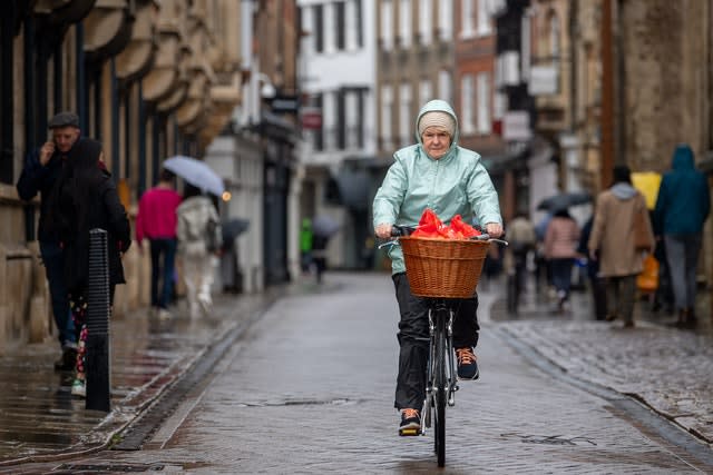 A woman cycling in Cambridge