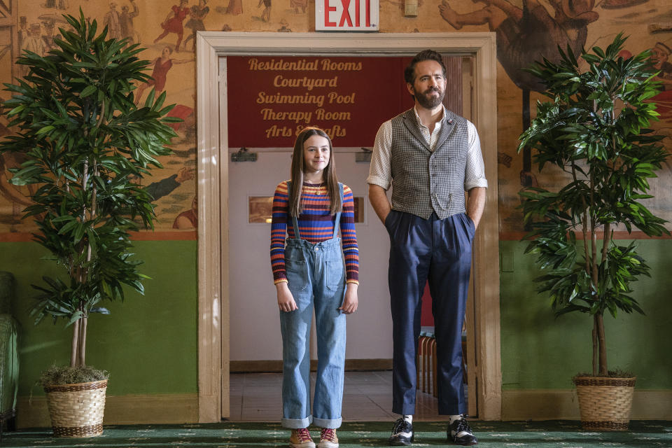 This image released by Paramount Pictures shows Cailey Fleming, left, and Ryan Reynolds in a scene from "IF." (Jonny Cournoyer/Paramount Pictures via AP)