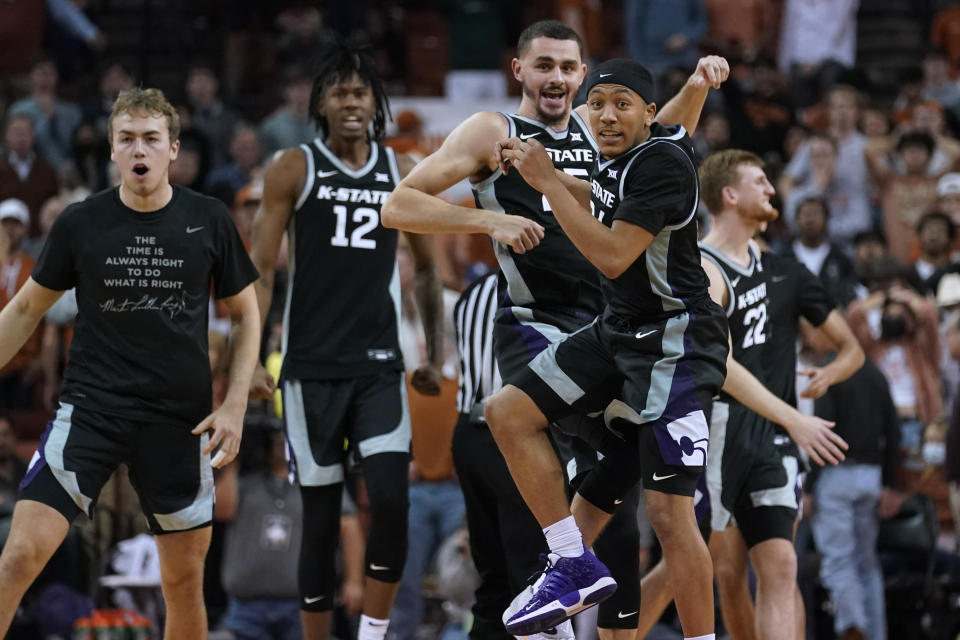 Kansas State players celebrate a win over Texas in an NCAA college basketball game Tuesday, Jan. 18, 2022, in Austin, Texas. (AP Photo/Eric Gay)