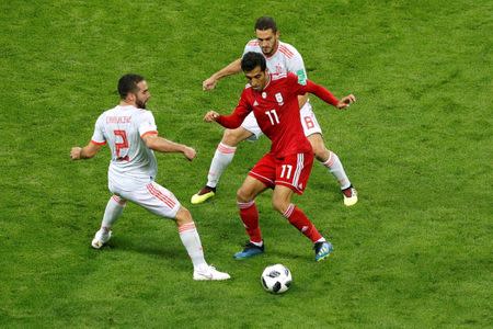 Soccer Football - World Cup - Group B - Iran vs Spain - Kazan Arena, Kazan, Russia - June 20, 2018 Iran's Vahid Amiri in action with Spain's Dani Carvajal and Koke REUTERS/John Sibley