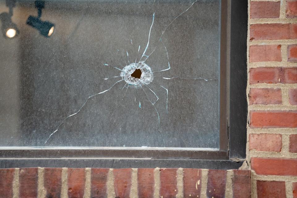 Bullet holes in Jolie Occasions' windows from the May 5 shootings in the Short North.