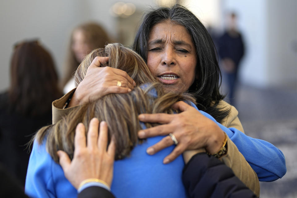 Churchgoers pray in the lobby of Lakewood Church, Sunday, Feb. 18, 2024, in Houston. Pastor Joel Osteen welcomed worshippers back to Lakewood Church for the first time since a woman with an AR-style opened fire in between services at his Texas megachurch last Sunday. (AP Photo/David J. Phillip)