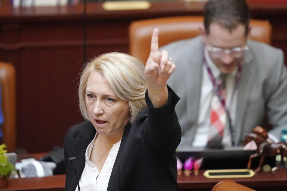Rep. Karianne Lisonbee, R-Clearfield, gestures on the House floor Thursday, March 2, 2023, in Salt Lake City. A proposal to ban abortion clinics in Utah and have them provided exclusively at hospitals passed the Utah Legislature. It now heads to Gov. Spencer Cox's desk. In Utah, the proposal from Lisonbee would require all abortions — via medication or surgery — be provided in hospitals by not allowing new clinics to be licensed after May 2 and not allowing any to operate once their licenses expire. (AP Photo/Rick Bowmer)