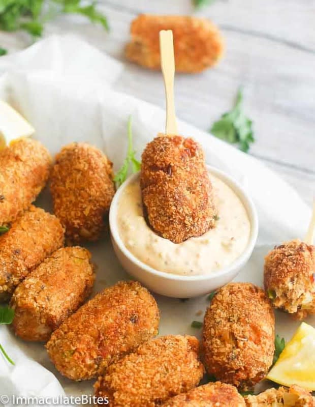 <p>African Bites</p><p>Salmon Croquettes are pan-fried, protein-packed, breadcrumbed rolls made with salmon and aromatic herbs. Crispy on the outside with a soft and tender center. They make a quick and tasty appetizer, breakfast or dinner fix.</p><p><strong>Get the recipe: <a href="https://www.africanbites.com/salmon-croquettes/" rel="nofollow noopener" target="_blank" data-ylk="slk:Salmon Croquettes;elm:context_link;itc:0;sec:content-canvas" class="link ">Salmon Croquettes</a></strong></p>