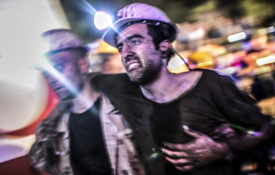 An injured miner came out carried by rescuers, on May 13, 2014 after an explosion in a coal mine in Manisa. (BULENT KILIC/AFP/Getty Images)