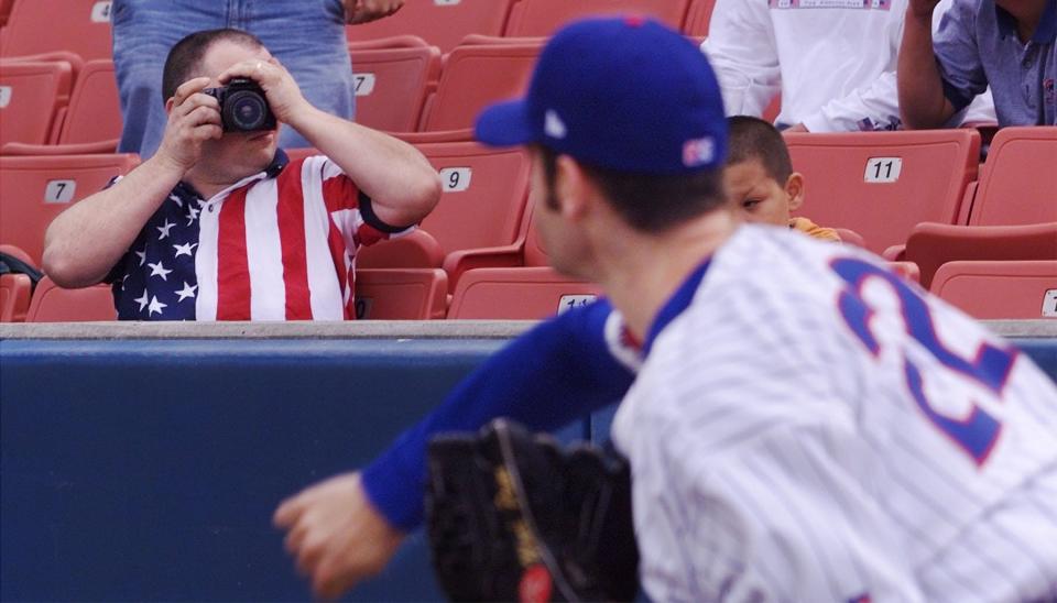 Dan Terry of Des Moines takes a photo of Iowa Cubs pitcher Mark Prior before Prior's first triple-A start on May 7, 2002, at Principal Park.