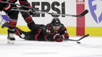 Carolina Hurricanes center Martin Necas dives for the puck against the New York Rangers during the second period in Game 3 of an NHL hockey Stanley Cup second-round playoff series Thursday, May 9, 2024, in Raleigh, N.C. (AP Photo/Chris Seward)
