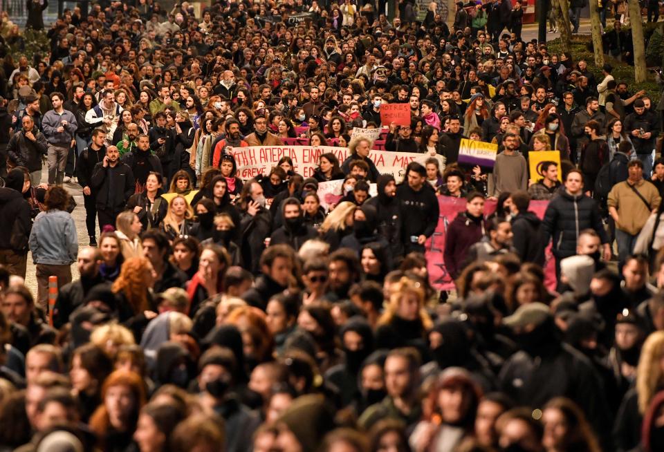 Thousands march during a rally to mark the International Women's Day as multiple demonstrations took place during a nationwide day of mass strikes and protests over the country's worst rail tragedy that killed 57 people last week in Athens, on March 8, 2023. - Around 23 000 demonstrators gathered in the Greek capital police said on March 8, as railways remain paralysed for the eighth straight day, as train workers extend strike action they launched in the aftermath of the accident. The demonstrations also came as Greek civil servants staged a 24-hour walkout, with doctors, teachers, and transport workers also going on strike. (Photo by Louisa GOULIAMAKI / AFP) (Photo by LOUISA GOULIAMAKI/AFP via Getty Images)