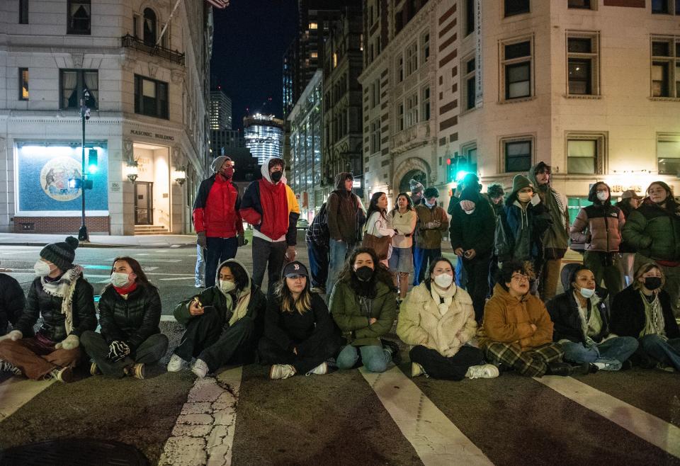 Pro-Palestinian supporters block a street as police deploy to clear their camp at Emerson College in Boston (AFP via Getty Images)