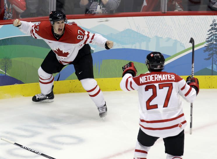 Canada’s Sidney Crosby (87) celebrates with Scott Niedermayer (27) after making the game-winning goal in the overtime period of a men’s gold medal ice hockey game against USA at the Vancouver 2010 Olympics in Vancouver, British Columbia, Sunday, Feb. 28, 2010. Canada won 3-2. (AP Photo/Chris O’Meara)