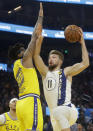 Indiana Pacers forward Domantas Sabonis (11) shoots against Golden State Warriors forward Marquese Chriss during the first half of an NBA basketball game in San Francisco, Friday, Jan. 24, 2020. (AP Photo/Jeff Chiu)