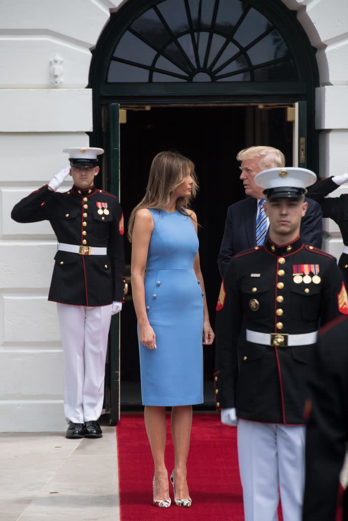 <p>FLOTUS awaited the Panamanian President and his wife in a formfitting. sky blue dress, which she paired with floral pumps.</p>