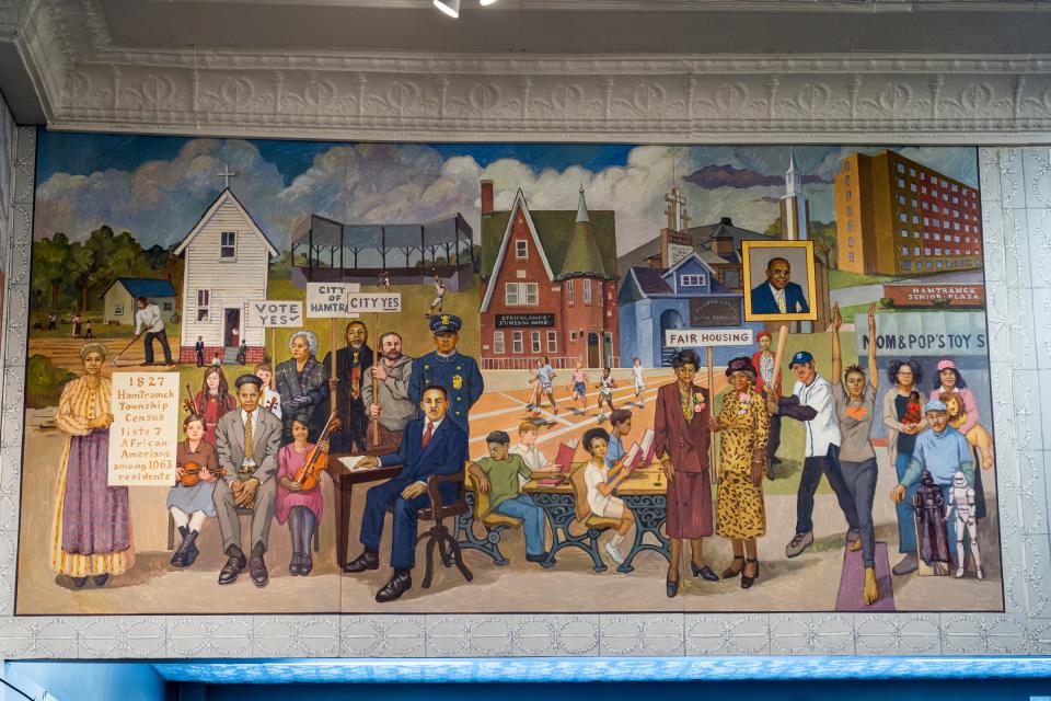 A mural made by artist Dennis Orlowski at the Hamtramck Historical Museum depicts the communities and history of the city.