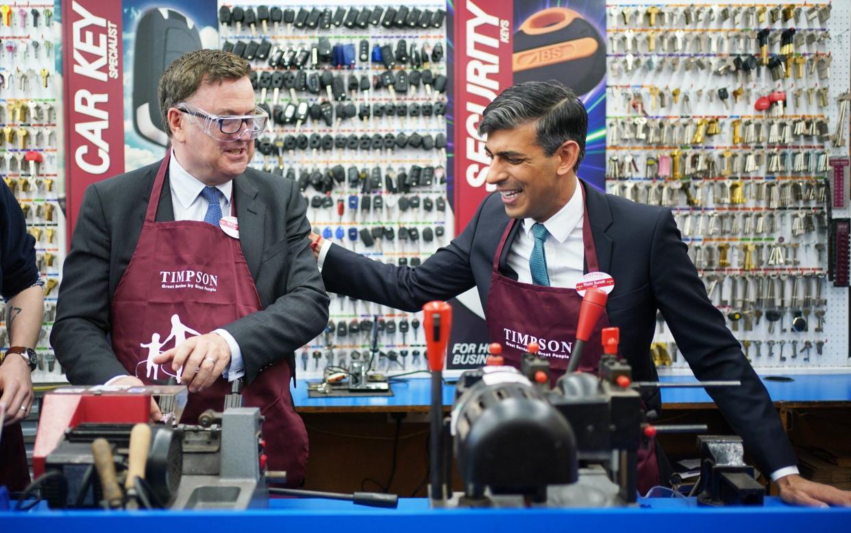 Mel Stride and Rishi Sunak during a visit to a branch of Timpson